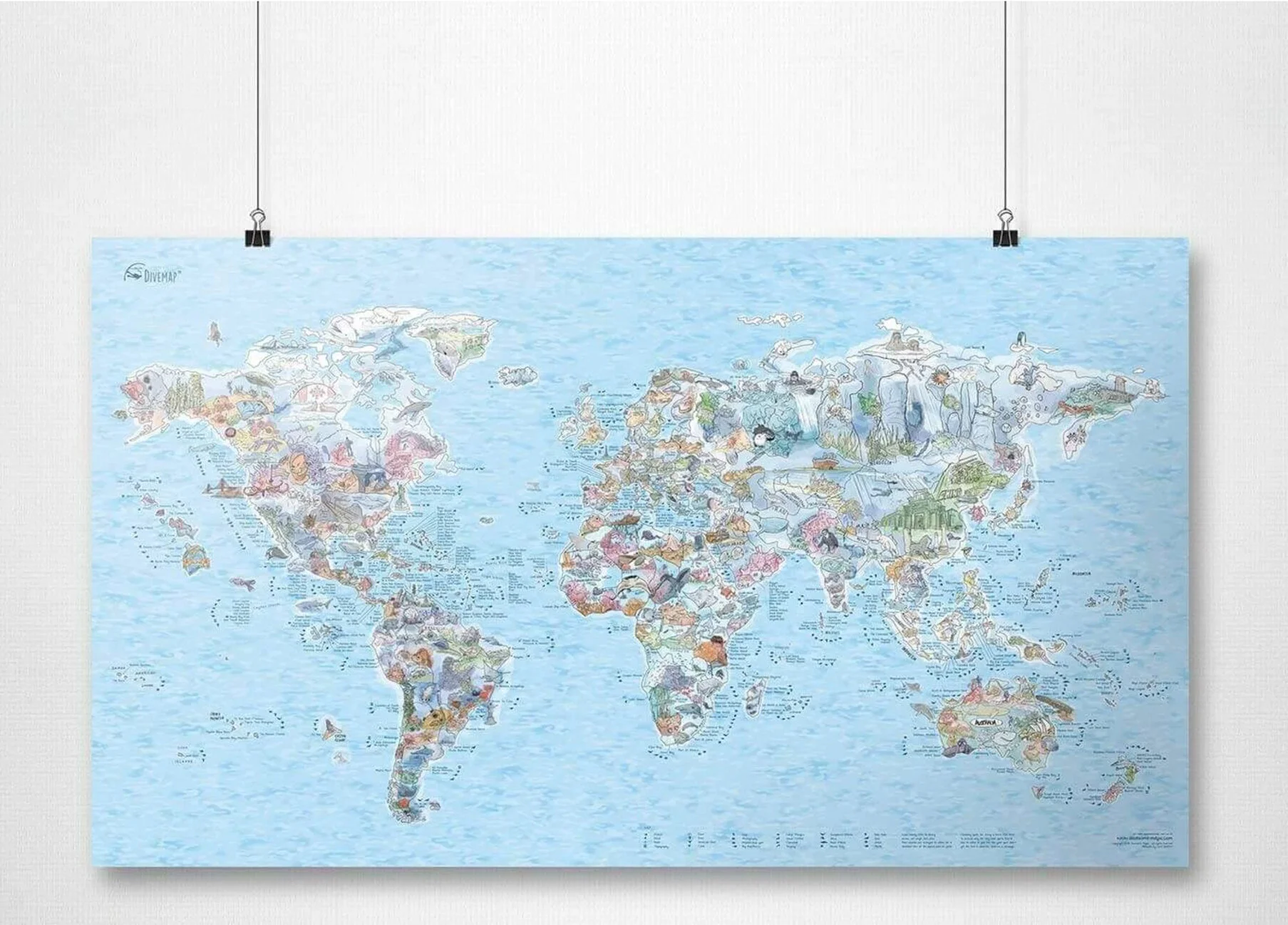 A hand-drawn world scuba diving and marine life map, hanging on a wall