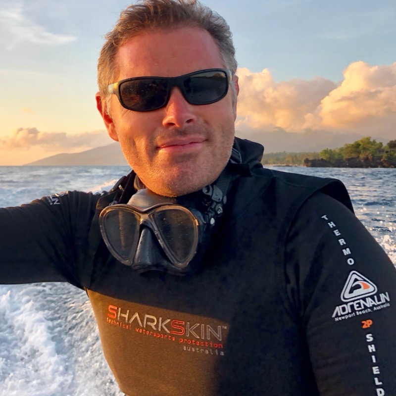 Simon on a dive boat with his Cressi Big Eyes Evolution mask around his neck