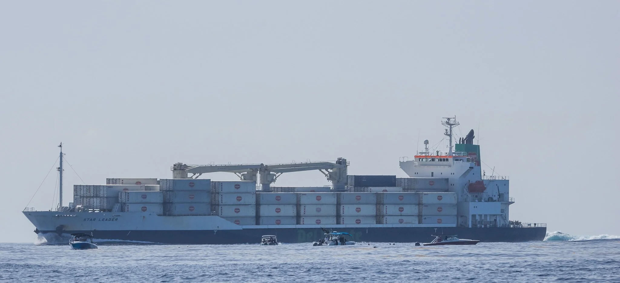 Large container ship moving through the whale shark feeding area off Cancun, Mexico